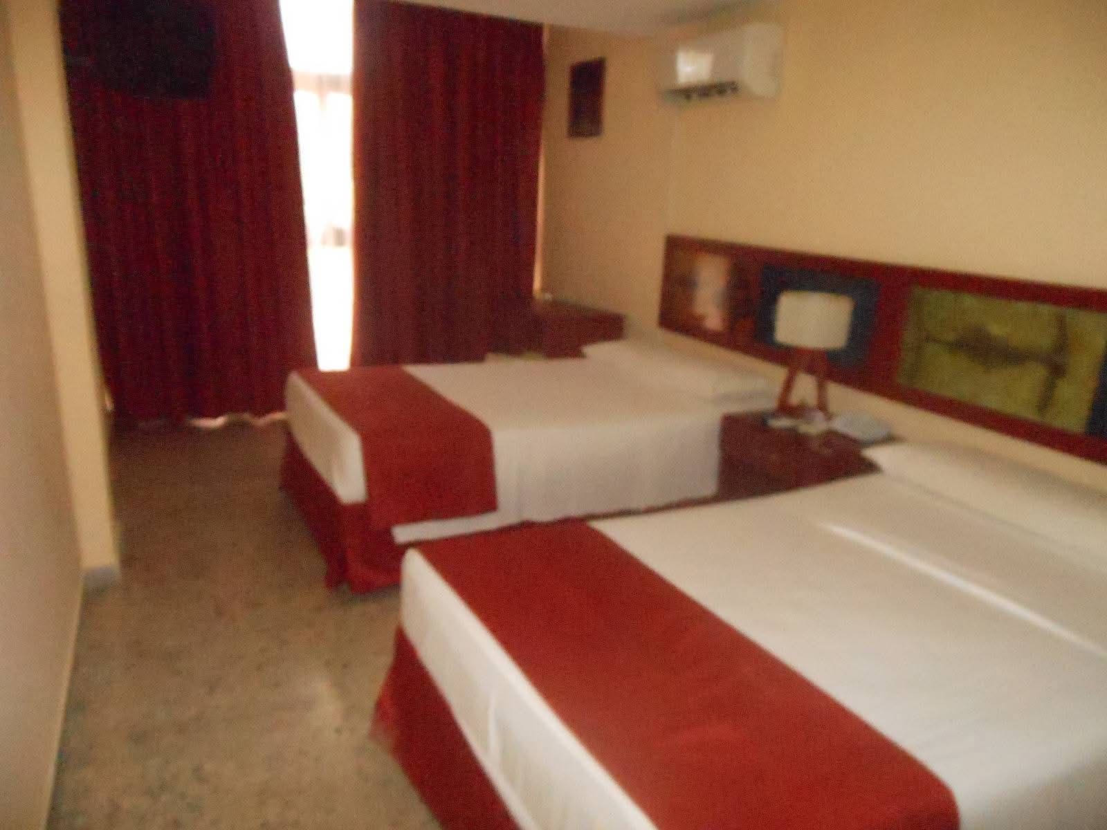 Bello Caribe suite with living area and bedroom