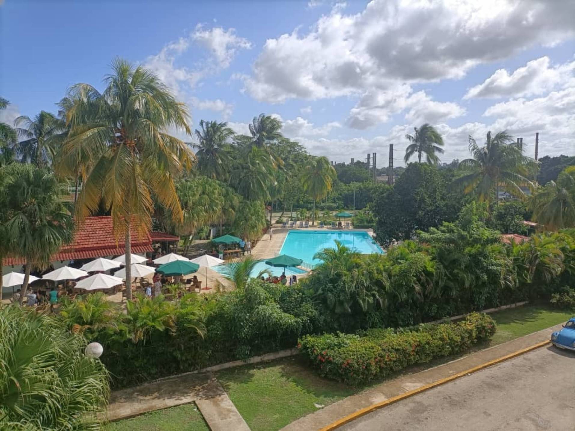 Bello Caribe compound with multiple swimming pools and tropical gardens